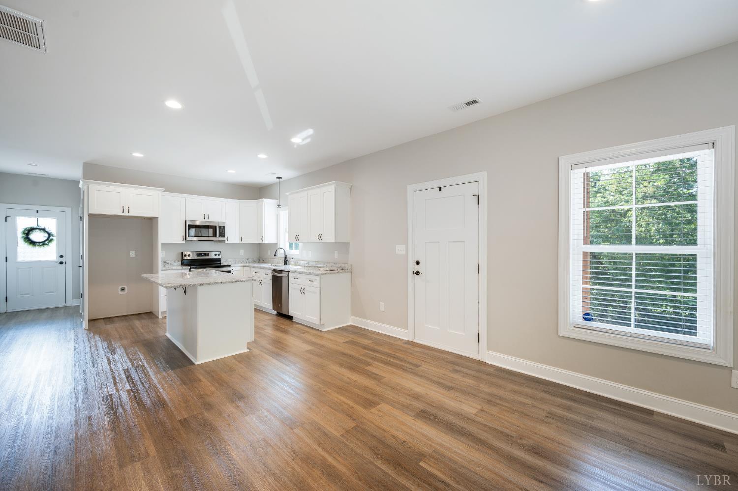 1200 Founding Way Road Bedford, VA 24523 - Photo 12 of 36 a kitchen with a refrigerator and white cabinets