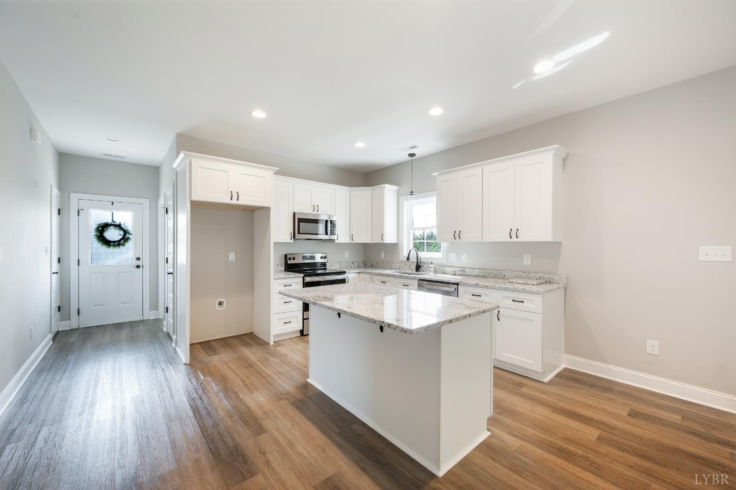 1200 Founding Way Road Bedford, VA 24523 - Photo 14 of 36 a kitchen with stainless steel appliances a sink a stove a refrigerator and cabinets