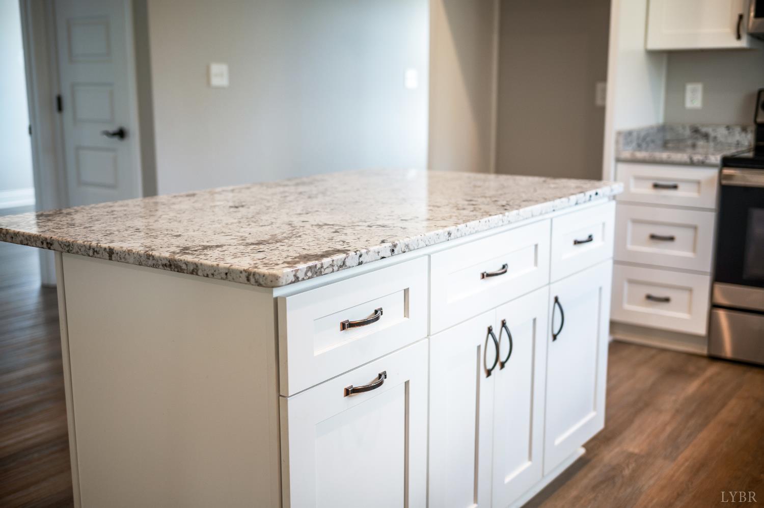 1200 Founding Way Road Bedford, VA 24523 - Photo 16 of 36 a kitchen with granite countertop white cabinets and white appliances