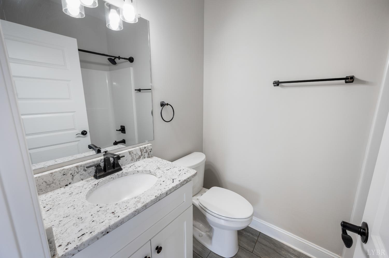 1200 Founding Way Road Bedford, VA 24523 - Photo 23 of 36 a bathroom with a granite countertop sink toilet and shower