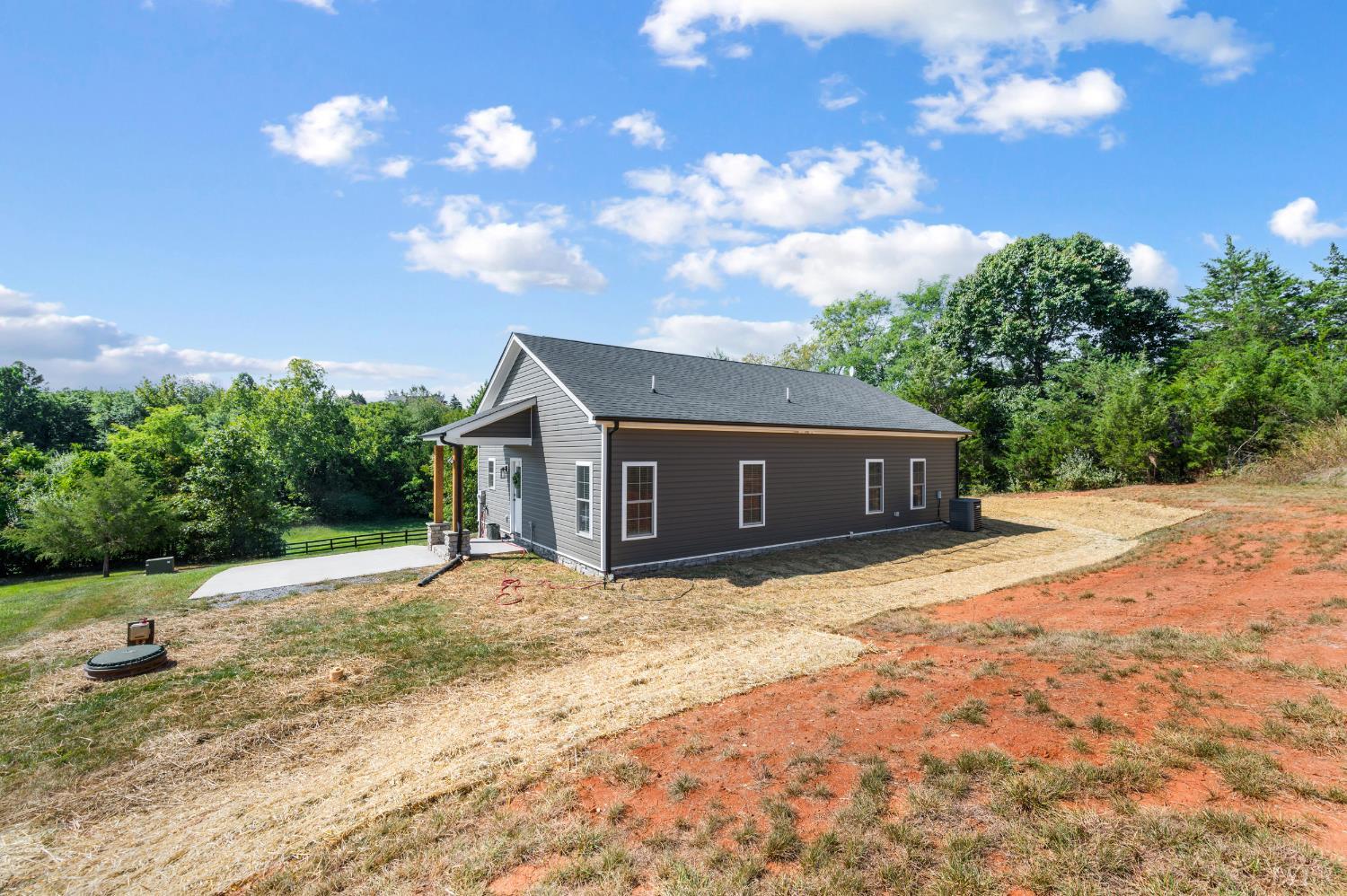 1200 Founding Way Road Bedford, VA 24523 - Photo 7 of 36 a house with trees in the background