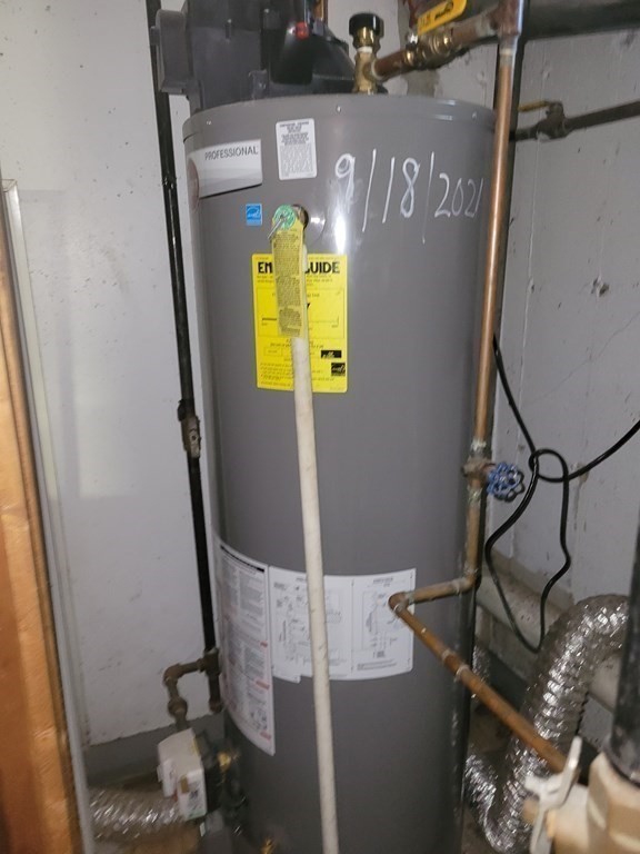 69 Fuller Street, Unit 69 Boston, MA 02124 - Photo 15 of 18 a bathroom with a sink and mirror