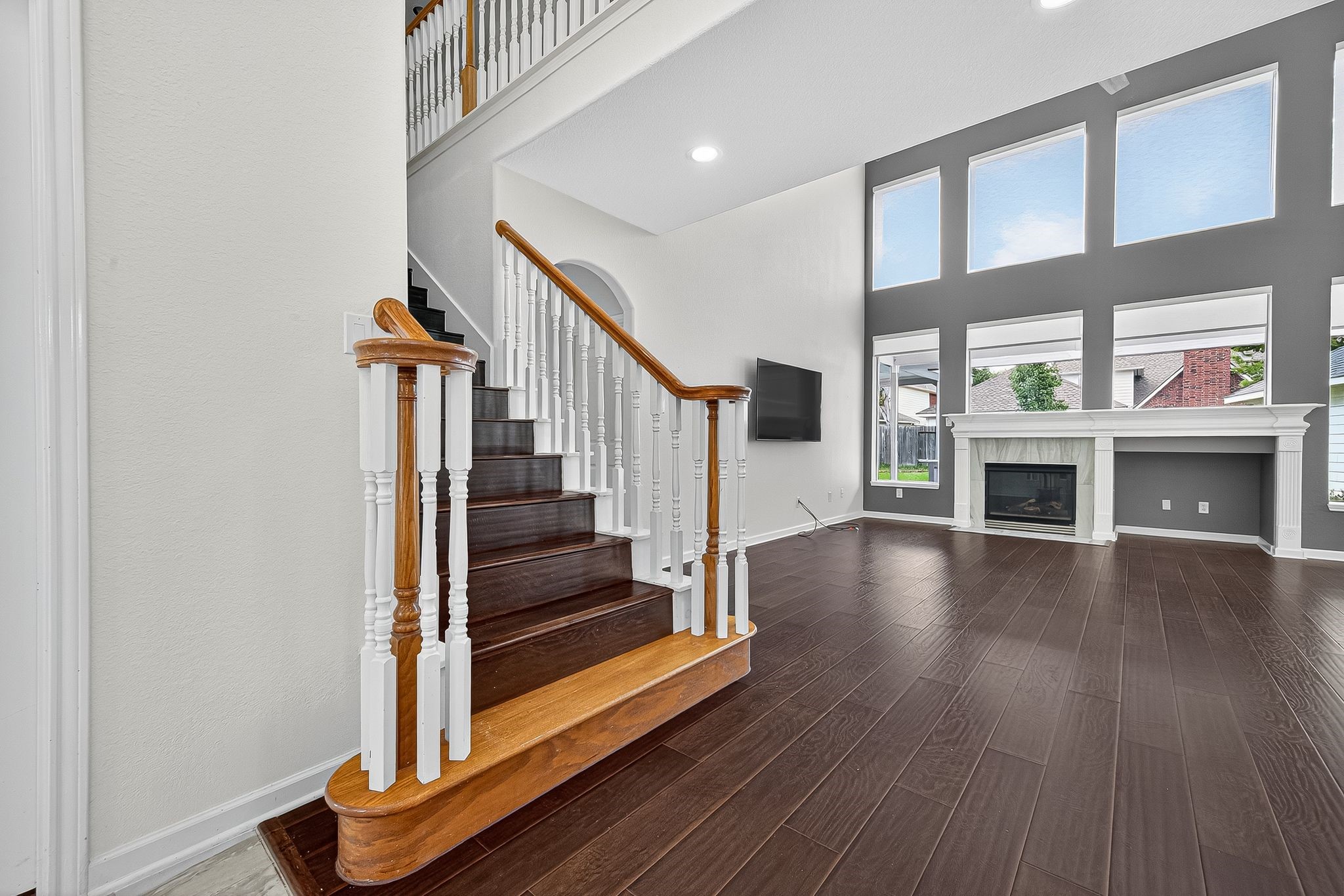 22406 Piper Terrace Lane Katy, TX 77450 - Photo 12 of 44 a view of a livingroom with wooden floor and stairs