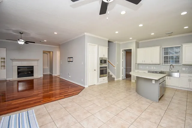 a kitchen with a stove a sink and a refrigerator
