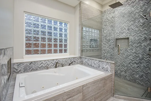 a spacious bathroom with a double vanity sink mirror and double