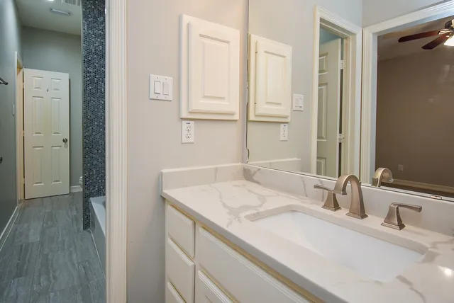 a bathroom with a bathtub and a shower