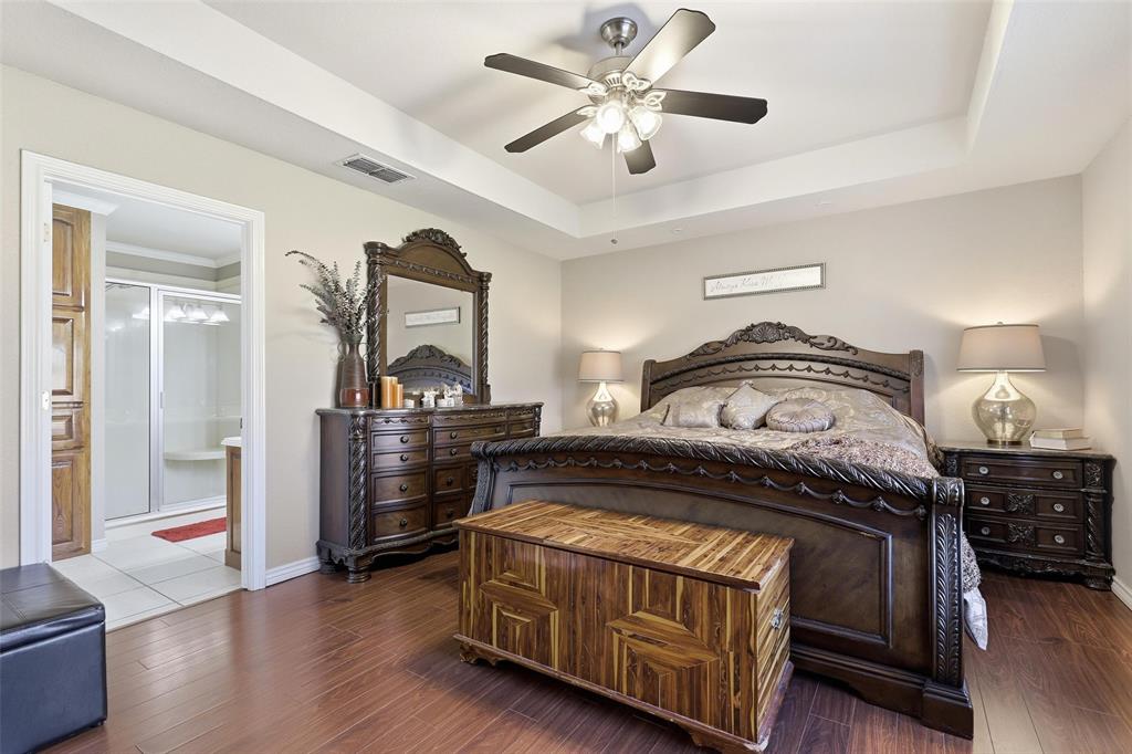 3207 Crossbridge Circle Granbury, TX 76049 - Photo 18 of 29 a bedroom with a bed and wooden floor