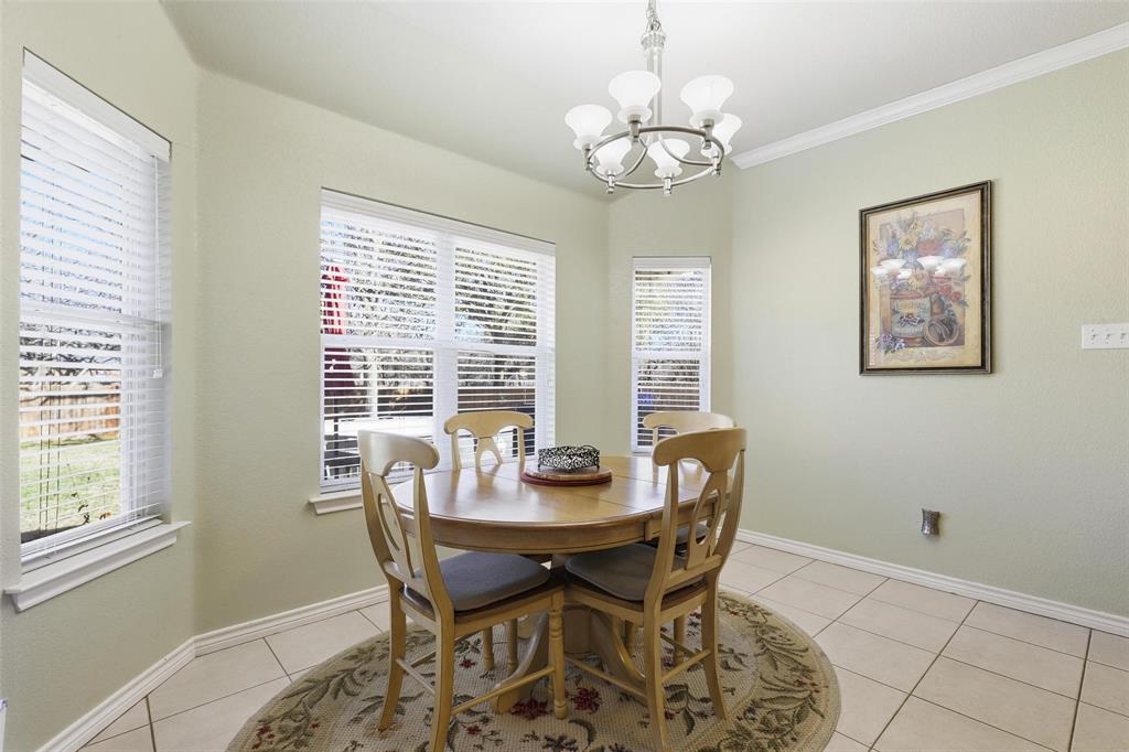 3207 Crossbridge Circle Granbury, TX 76049 - Photo 9 of 29 a dining room with furniture a chandelier and window