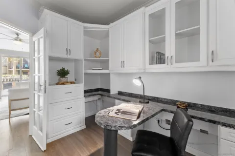 a kitchen with a sink cabinets and window