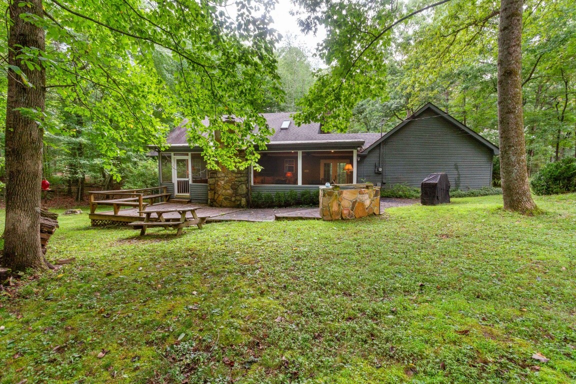 161 Curlicue Road Sewanee, TN 37375 - Photo 2 of 50 a backyard of a house with table and chairs