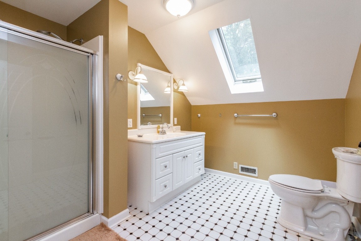 161 Curlicue Road Sewanee, TN 37375 - Photo 12 of 50 a bathroom with a sink mirror vanity and toilet