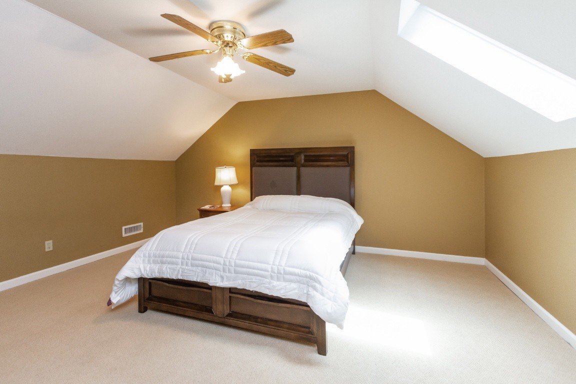 161 Curlicue Road Sewanee, TN 37375 - Photo 19 of 50 a bedroom with a bed and a ceiling fan