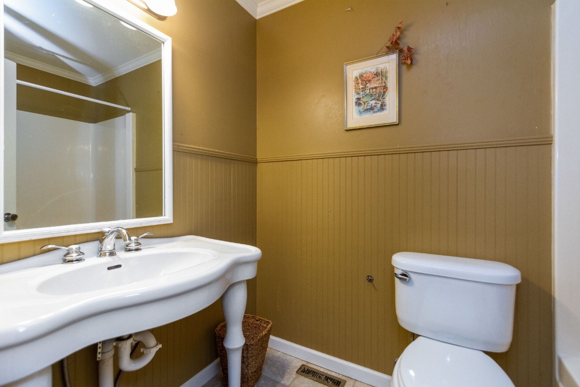 161 Curlicue Road Sewanee, TN 37375 - Photo 25 of 50 a bathroom with a toilet sink and mirror