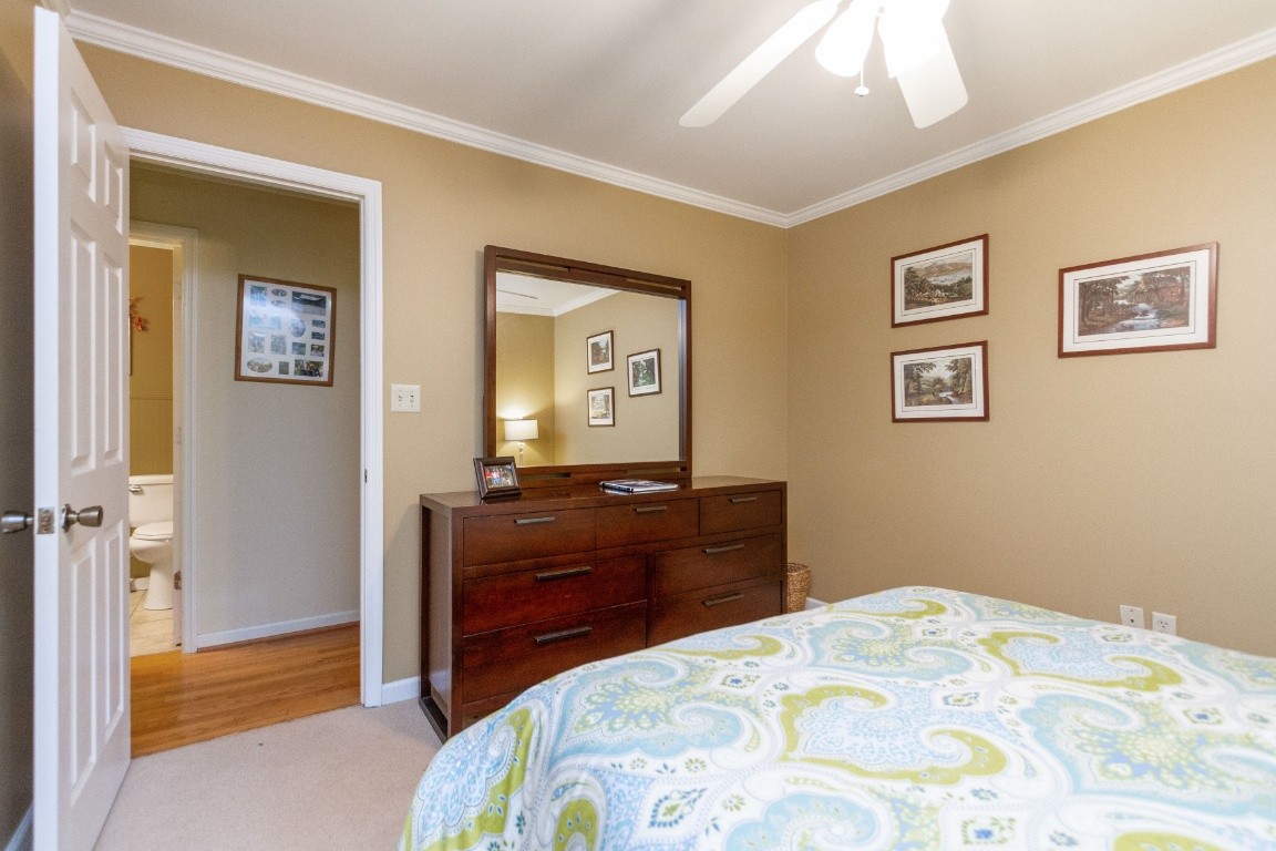 161 Curlicue Road Sewanee, TN 37375 - Photo 27 of 50 a bedroom with a bed and a dresser in it