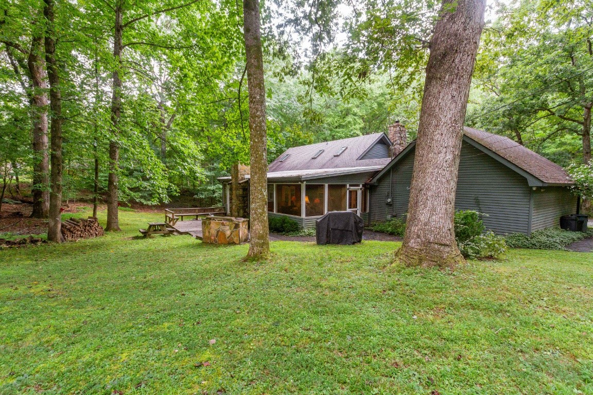 161 Curlicue Road Sewanee, TN 37375 - Photo 4 of 50 a view of a house with a yard