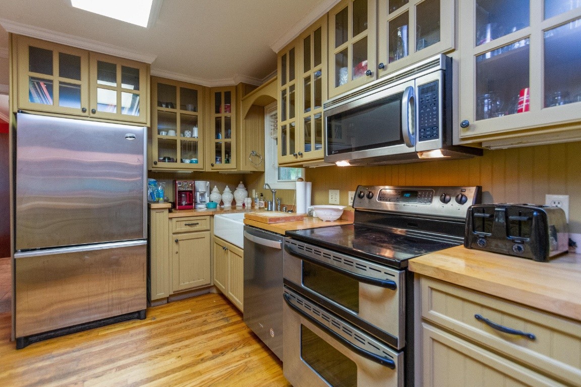 161 Curlicue Road Sewanee, TN 37375 - Photo 36 of 50 a kitchen with stainless steel appliances granite countertop a stove and a microwave