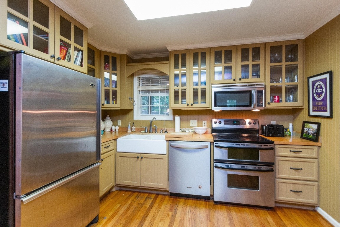 161 Curlicue Road Sewanee, TN 37375 - Photo 38 of 50 a kitchen with stainless steel appliances granite countertop a stove and a refrigerator