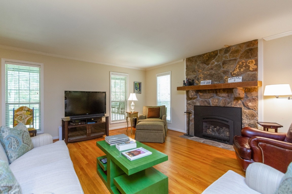 161 Curlicue Road Sewanee, TN 37375 - Photo 40 of 50 a living room with furniture a flat screen tv and a fireplace