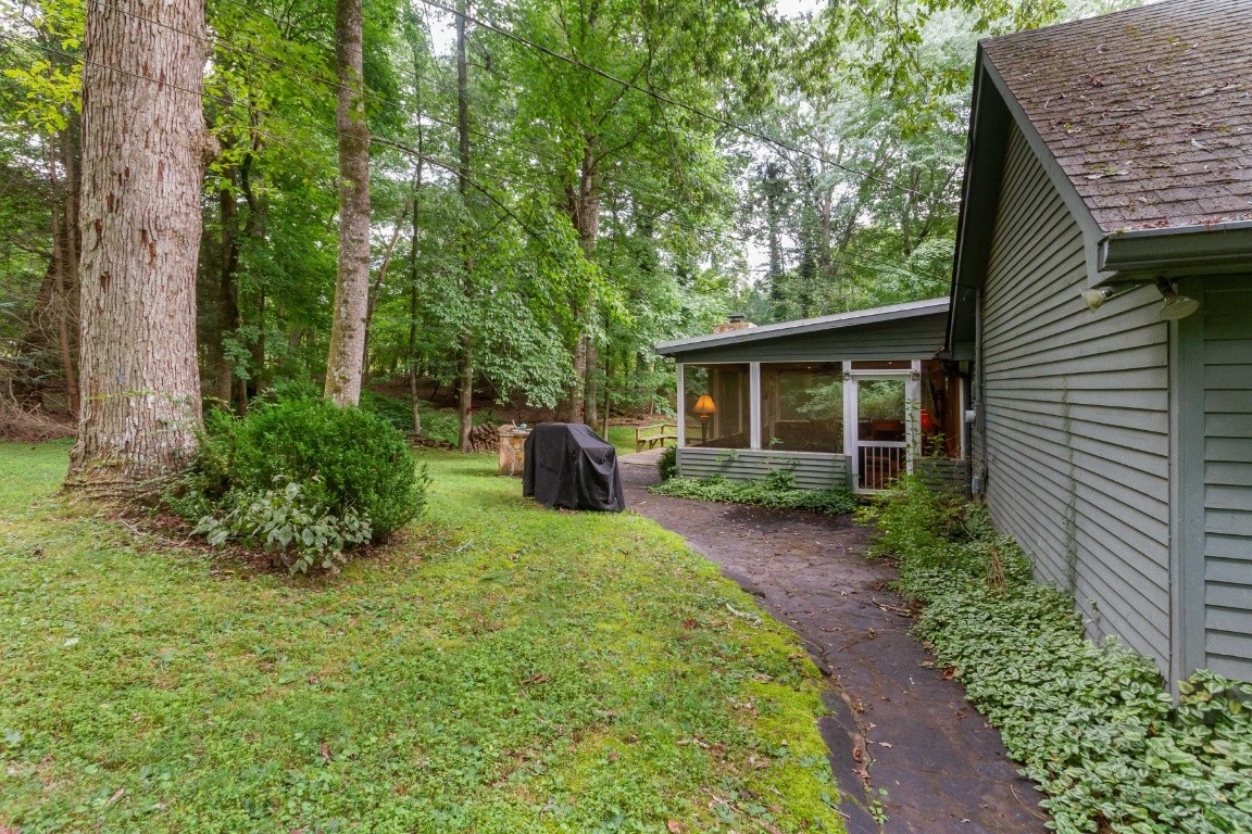 161 Curlicue Road Sewanee, TN 37375 - Photo 5 of 50 a view of a house with backyard and garden