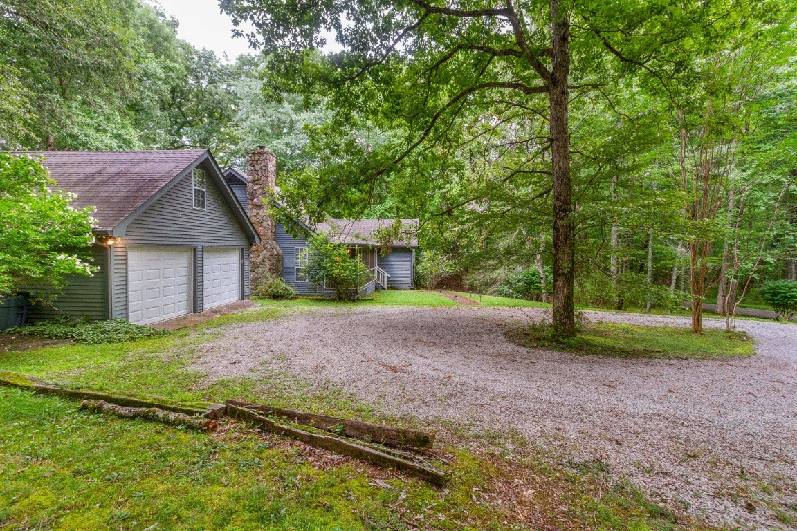 161 Curlicue Road Sewanee, TN 37375 - Photo 6 of 50 a house with huge green field in front of it