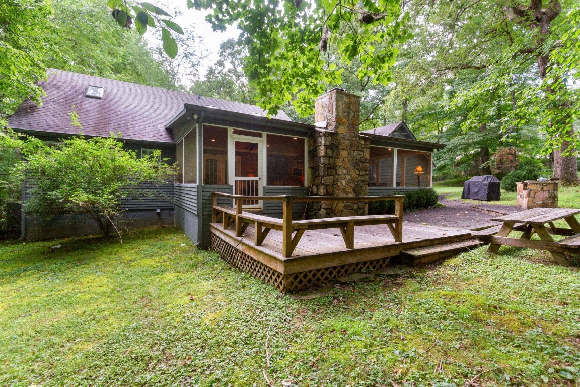 161 Curlicue Road Sewanee, TN 37375 - Photo 7 of 50 a wooden bench sitting in middle of a yard