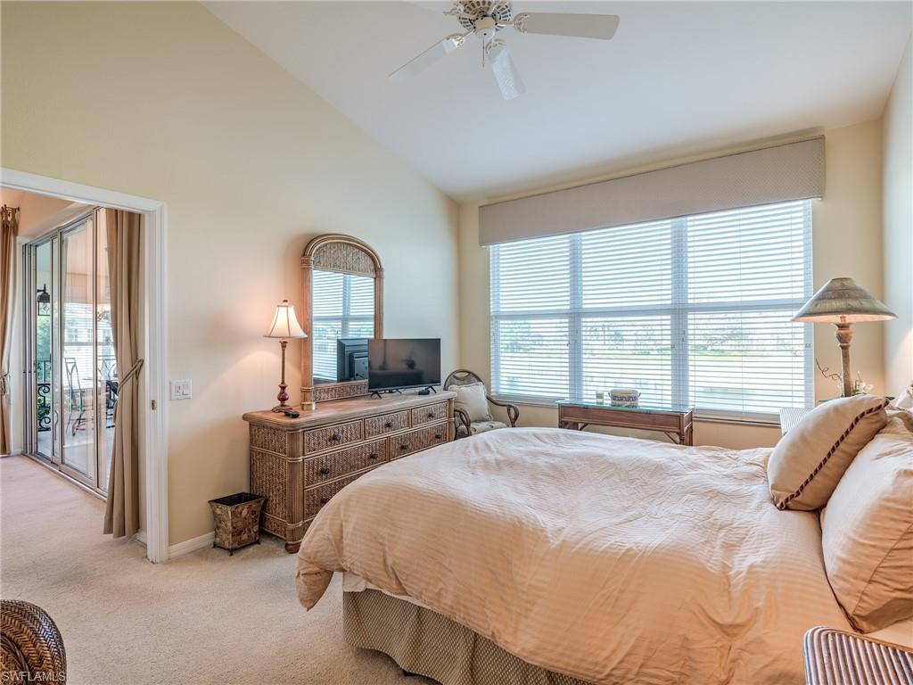 9830 Spring Run Boulevard, Unit 3408 Estero, FL 34135 - Photo 14 of 24 a bedroom with a bed and a large window