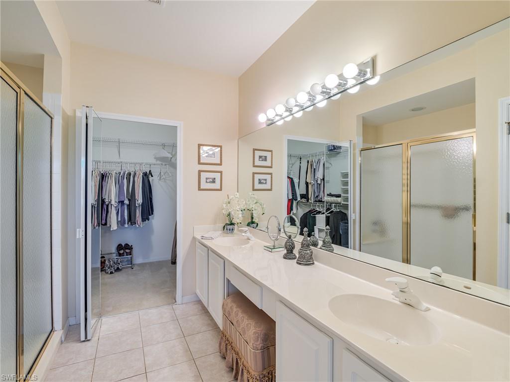 9830 Spring Run Boulevard, Unit 3408 Estero, FL 34135 - Photo 16 of 24 a bathroom with a sink double vanity