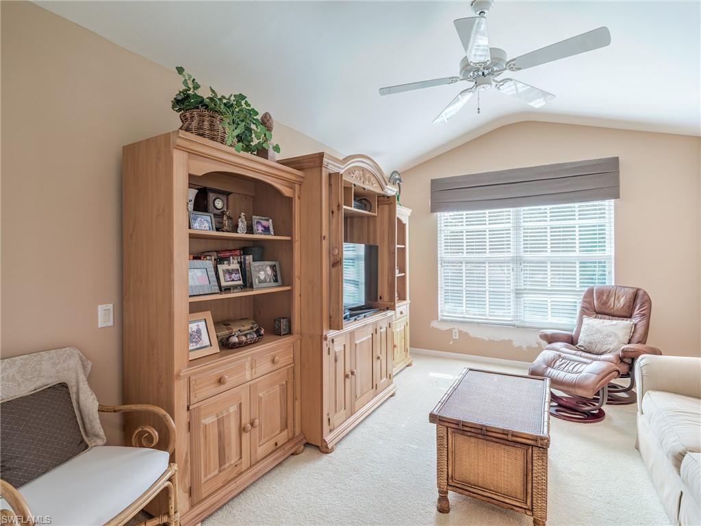 9830 Spring Run Boulevard, Unit 3408 Estero, FL 34135 - Photo 17 of 24 a living room with furniture and a window