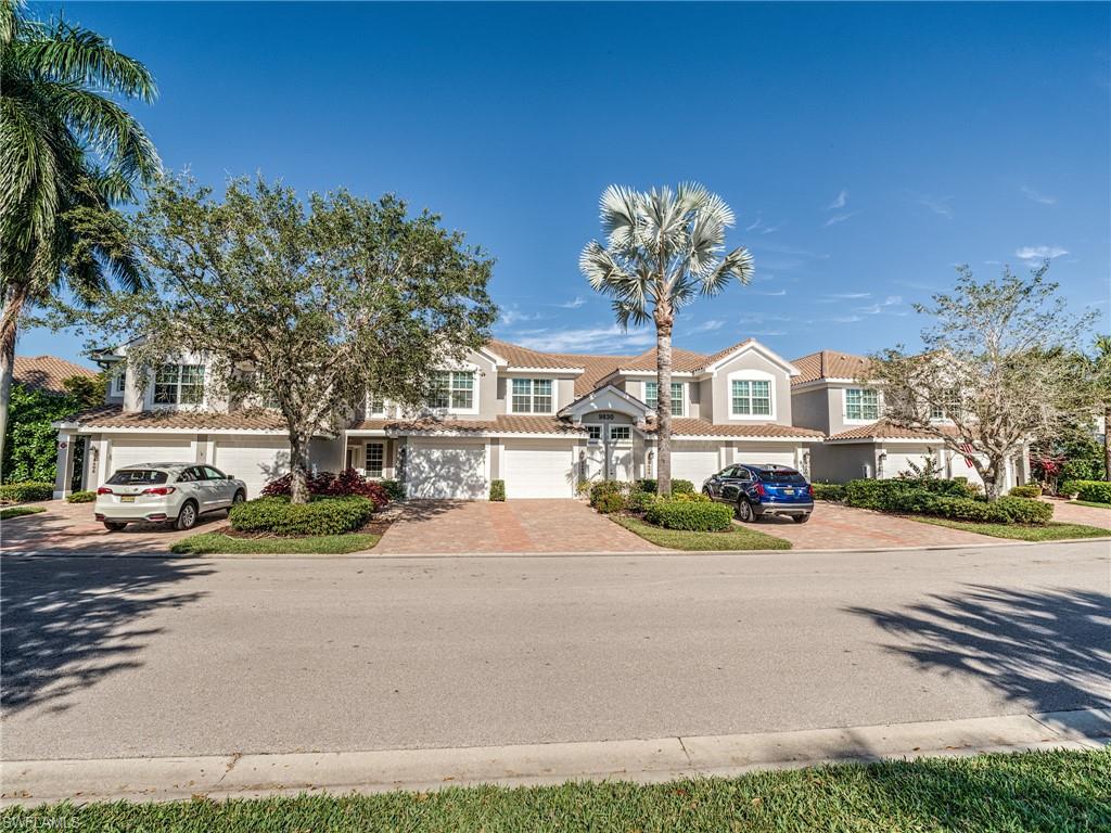 9830 Spring Run Boulevard, Unit 3408 Estero, FL 34135 - Photo 24 of 24 a view of street with parked cars