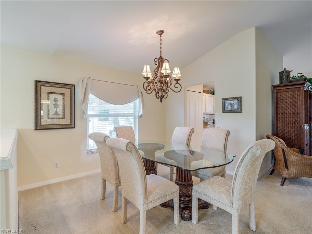 9830 Spring Run Boulevard, Unit 3408 Estero, FL 34135 - Photo 9 of 24 a dining room with furniture and window