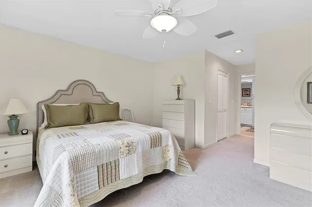 a bedroom with a bed and a closet