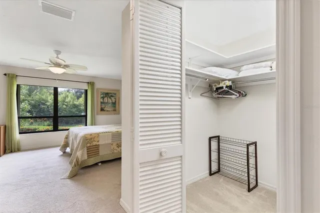 a living room with a bed furniture and a window