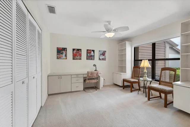 a bedroom with furniture and a window