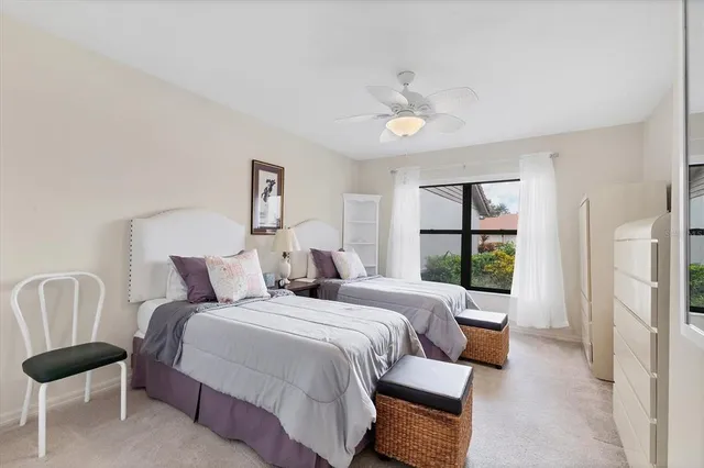 a bed room with a bed and a window