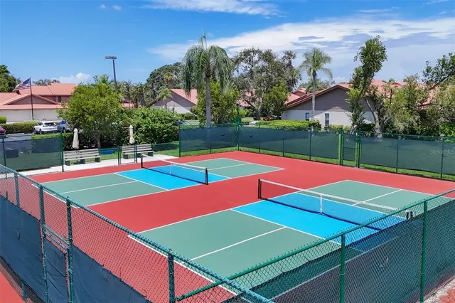 a view of an outdoor space with pool and sitting area