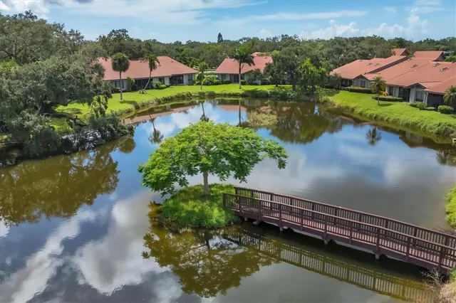 an aerial view of a house with a lake view