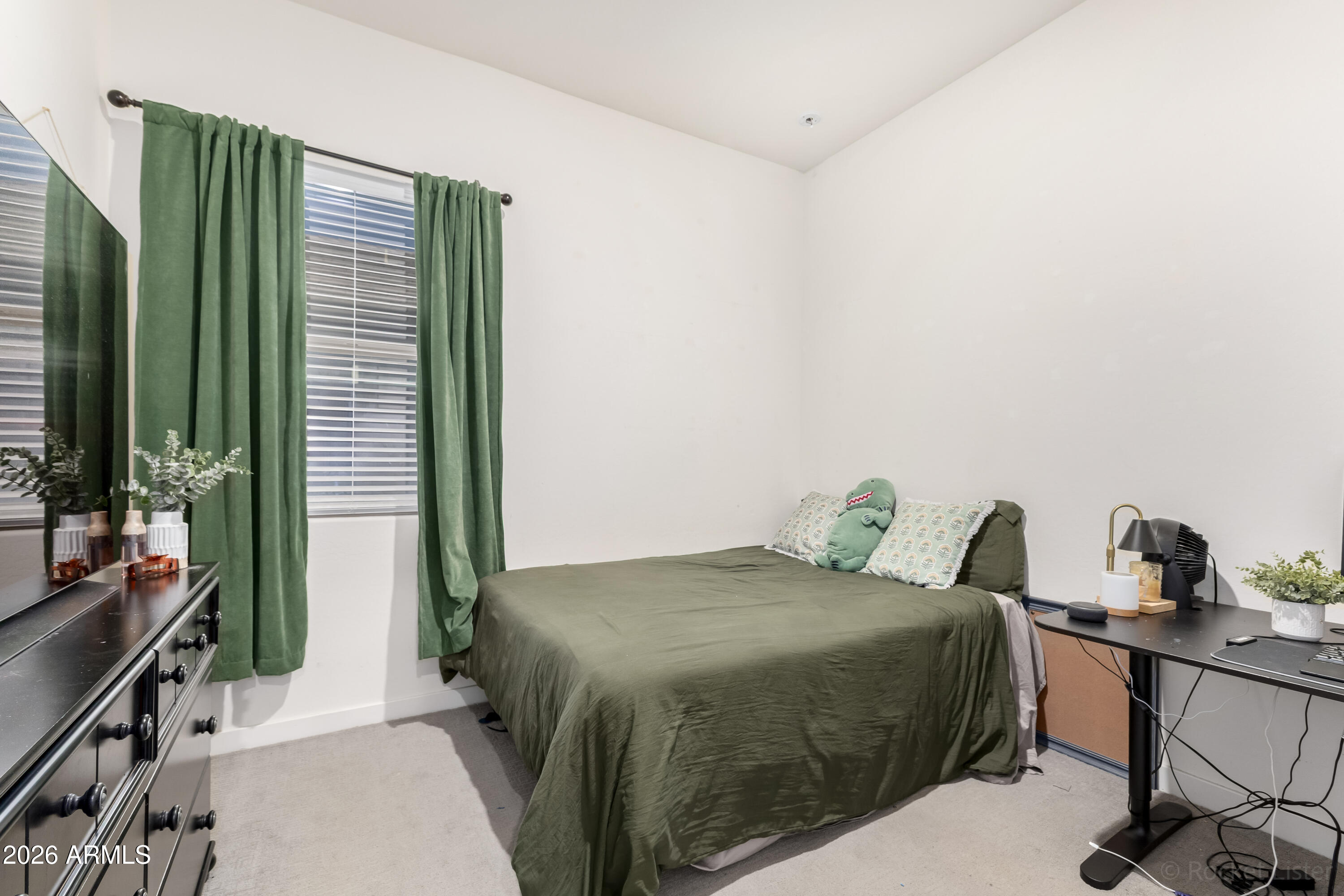 23929 North 166th Lane Surprise, AZ 85387 - Photo 14 of 23 a bedroom with a bed and a flat tv screen on the table