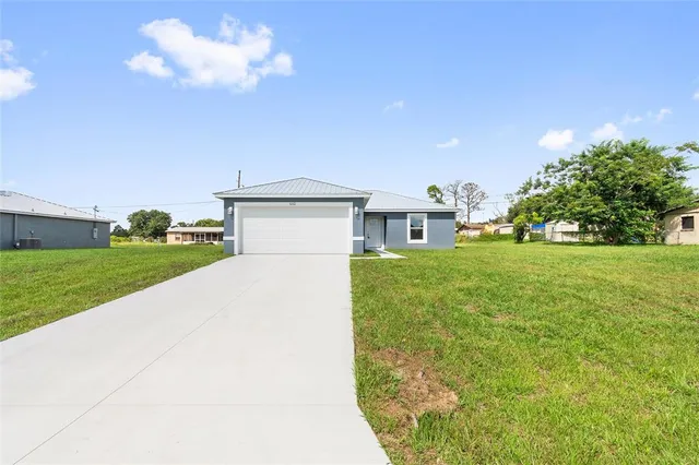 a view of a house with a big yard