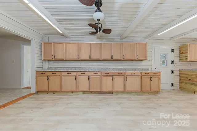 a large kitchen with cabinets