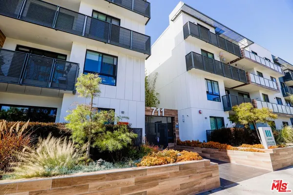 a front view of a building with an outdoor space