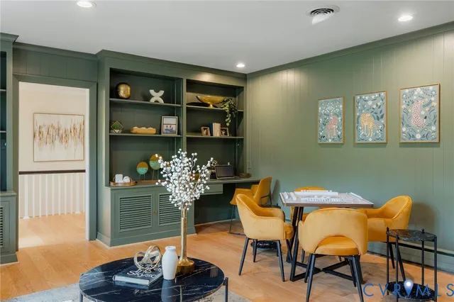 a dining room with furniture and chandelier