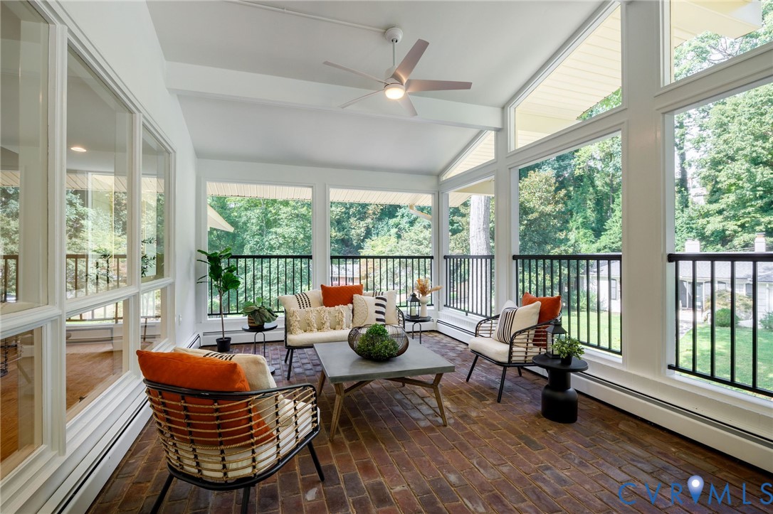 210 West Hillcrest Avenue Aylett, VA 23009 - Photo 32 of 50 a living room with patio furniture and a floor to ceiling window