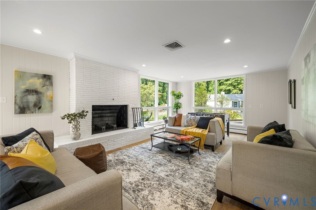 210 West Hillcrest Avenue Aylett, VA 23009 - Photo 36 of 50 a living room with furniture and a fireplace
