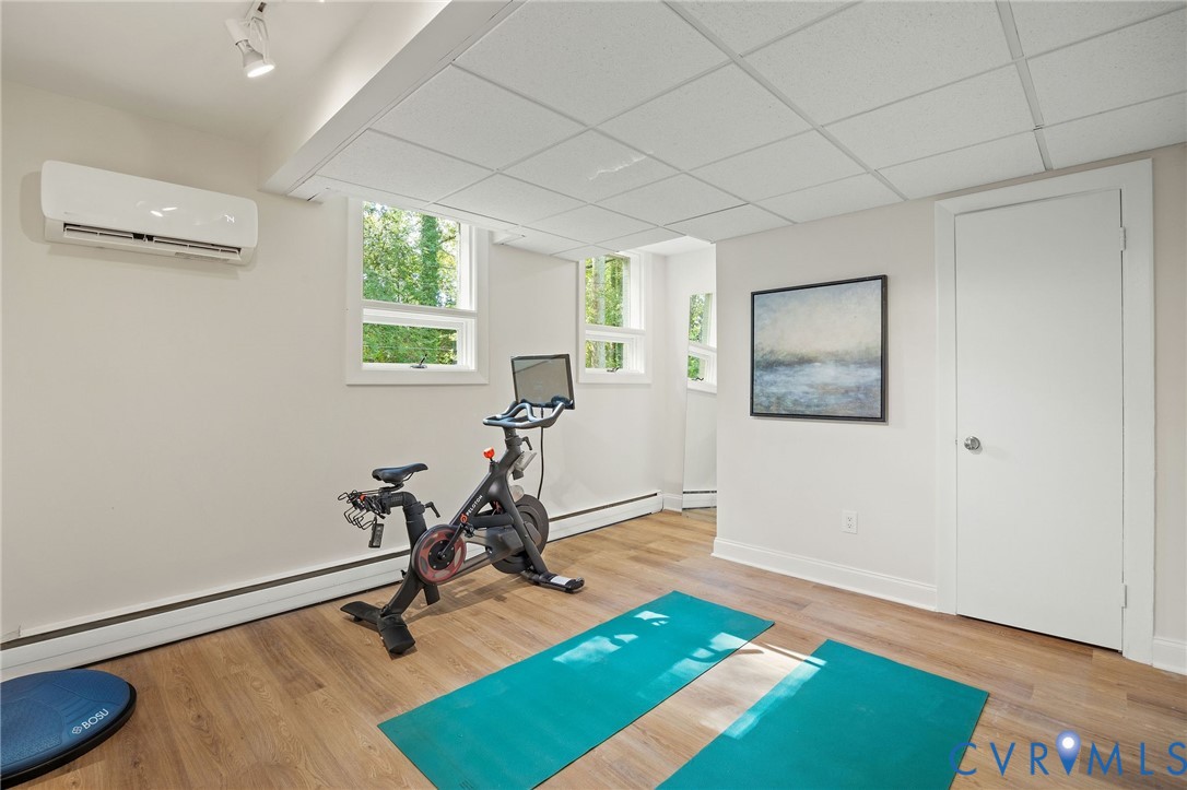 210 West Hillcrest Avenue Aylett, VA 23009 - Photo 41 of 50 a view of a room with gym equipment and windows