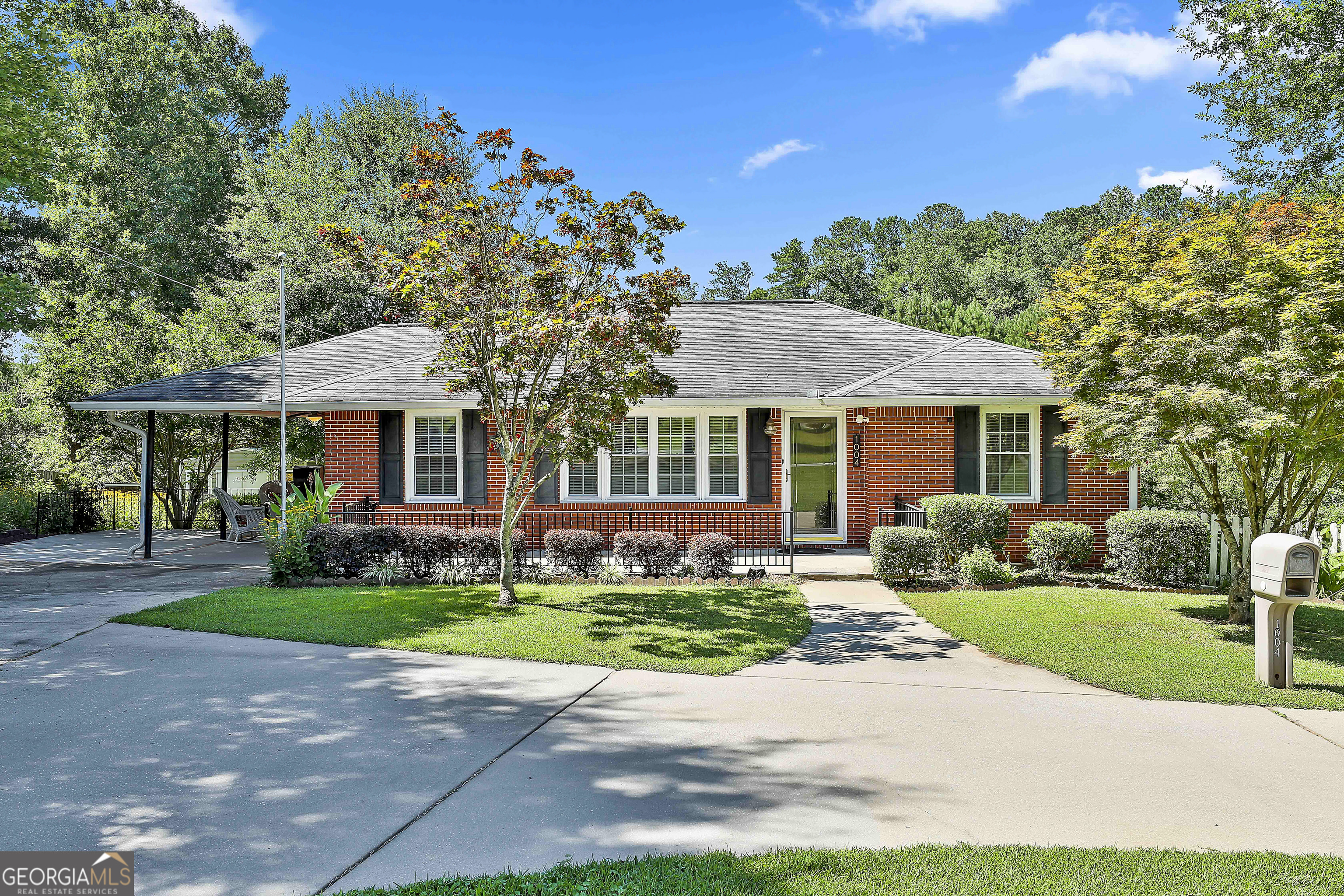 1004 Welcome Road Newnan, GA 30263 - Photo 1 of 1 a front view of a house with a yard