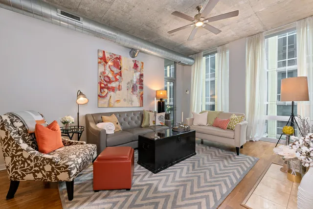 a living room with furniture and a large window