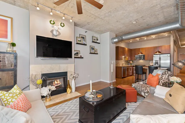 a kitchen with stainless steel appliances granite countertop a sink refrigerator and cabinets