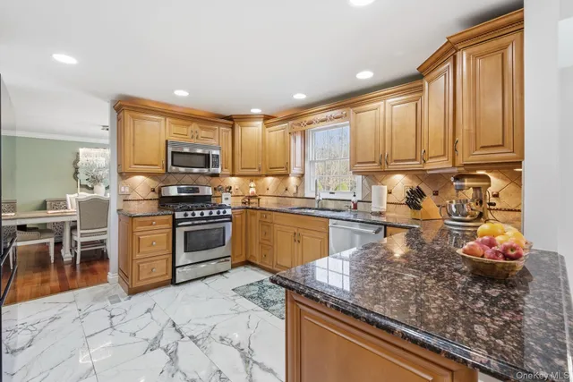a kitchen with a stove a sink and a microwave