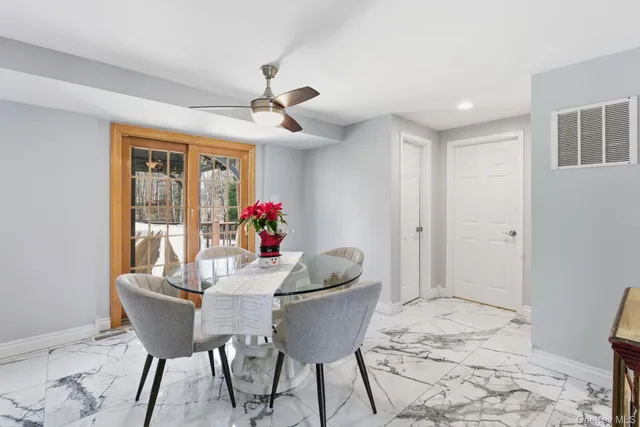 a dining room with furniture and window