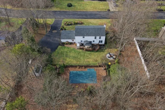 a backyard of a house with outdoor seating
